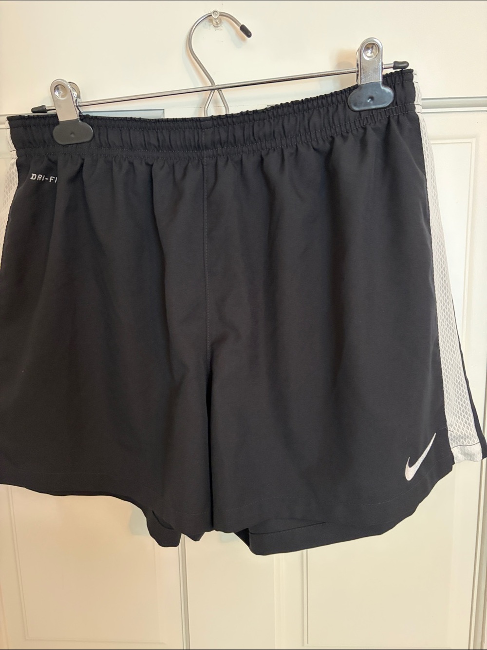 Nike Black Athletic Shorts with White Side Mesh and Swoosh